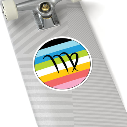 Close-up of the bottom of a silver skateboard featuring a 6 inch by 6 inch circular zodiac sticker with a centered Virgo glyph on a Queer pride flag style background applied to the surface.