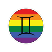 Circular rainbow pride flag zodiac sticker with a thin black outline and white sticker border, featuring a centered black Gemini zodiac glyph. The sticker is shown on a white background.