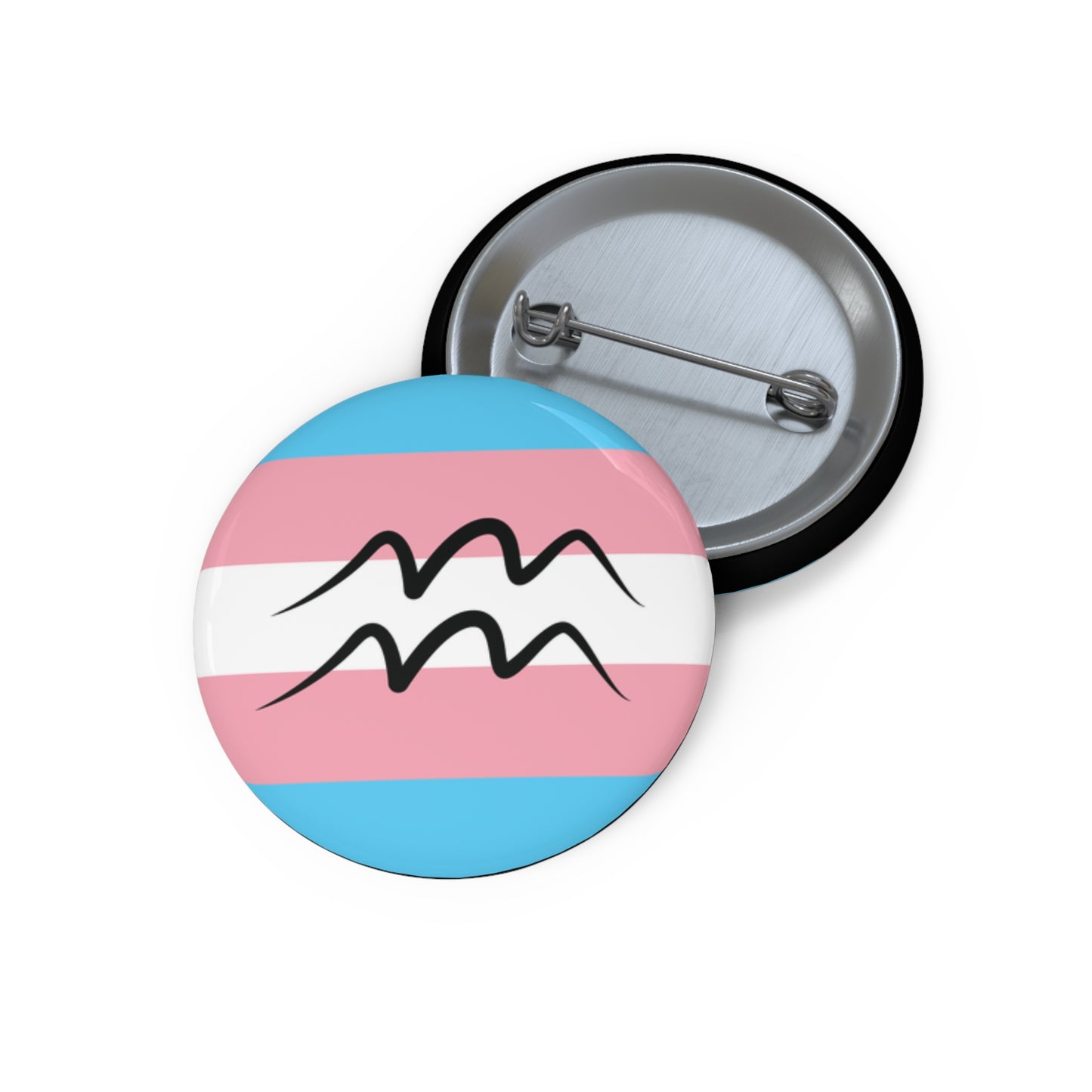 Aquarius pride button featuring a circular design filled with the transgender pride flag colors with a black Aquarius symbol centered on the front. The back of the button with metal pin clasp is shown beside the front.