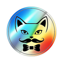 Circular holographic Queer Kitty logo sticker featuring a stylized cat face with a curled mustache and bow tie on a rainbow reflective background. The sticker is shown here on a white background.
