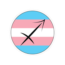 Circular transgender pride flag zodiac sticker with a thin black outline and white sticker border, featuring a centered black Sagittarius zodiac glyph. The sticker is shown on a white background.