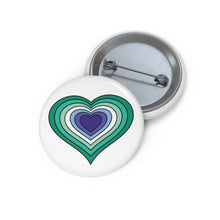 Front and back view of a white circular button with a heart-shaped gay men flag image. The button is shown on a white background.