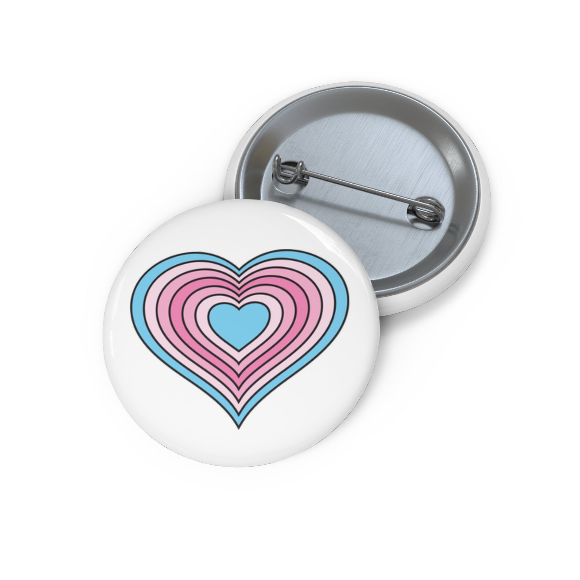 Front and back view of a white circular button with a heart-shaped transfeminine pride flag image. The button is shown on a white background.