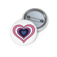 Front and back view of a white circular button with a heart-shaped genderfluid flag image. The button is shown on a white background.