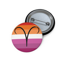 Front and back view of a circular lesbian pride flag button featuring the Aries zodiac symbol in black centered on the front.