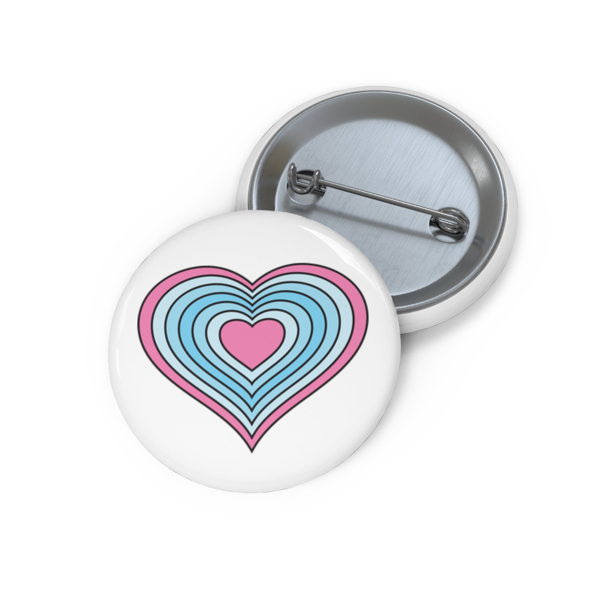 Front and back view of a white circular button with a heart-shaped transmasculine pride flag image. The button is shown on a white background.