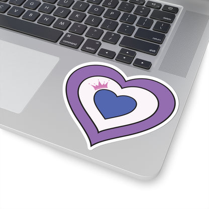 Close-up of the bottom right corner of a silver laptop featuring a 4 inches by 4 inches pride flag heart sticker in a Drag pride flag style applied to the surface.