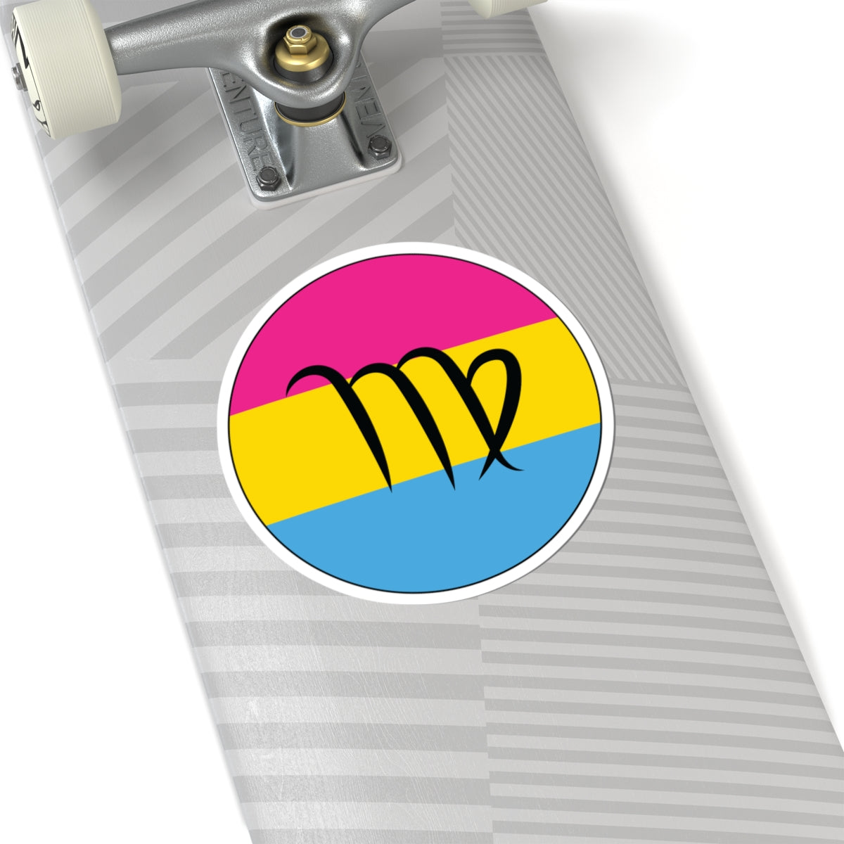 Close-up of the bottom of a silver skateboard featuring a 6 inch by 6 inch circular zodiac sticker with a centered Virgo glyph on a Pansexual pride flag style background applied to the surface.