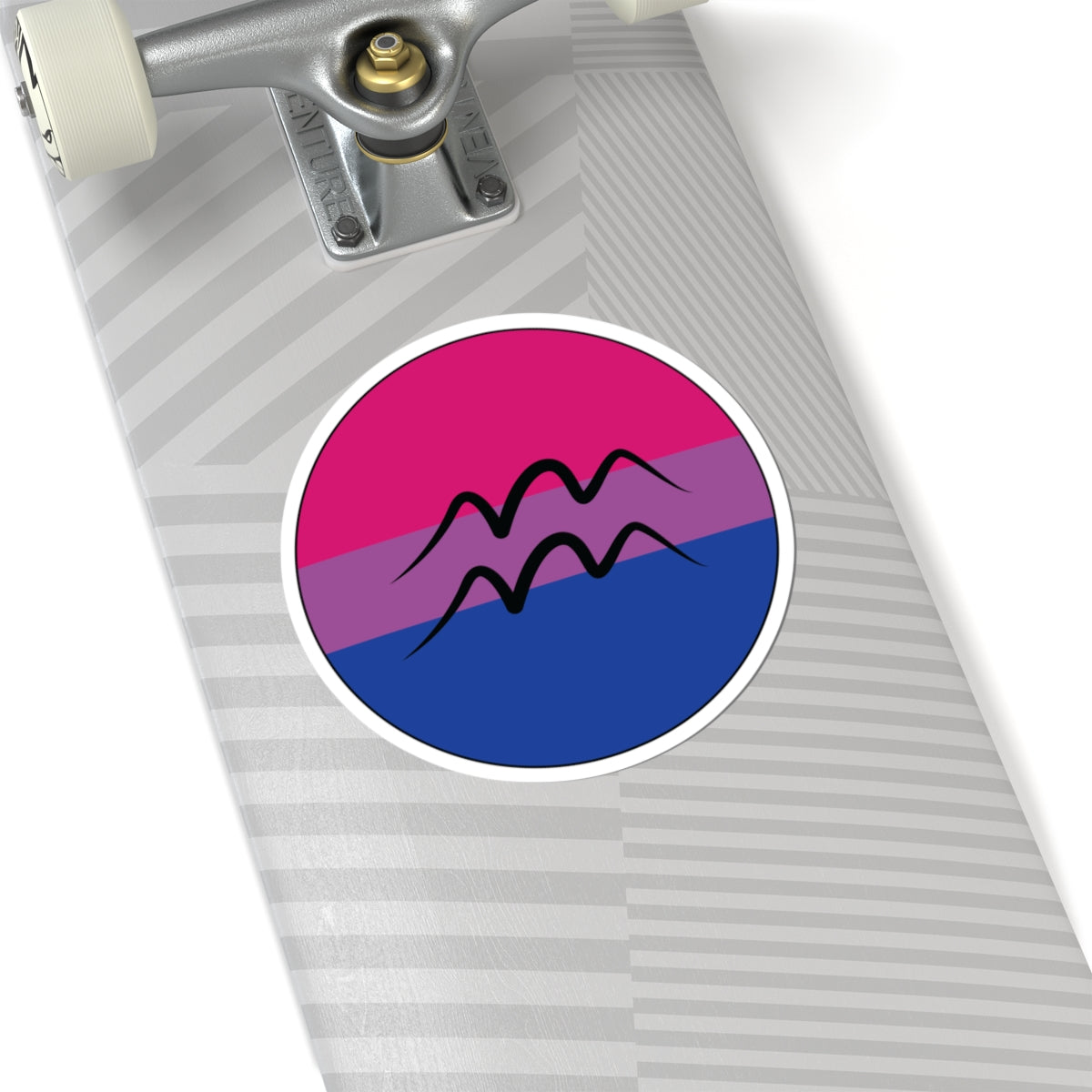 Close-up of the bottom of a silver skateboard featuring a 6 inch by 6 inch circular zodiac sticker with a centered Aquarius glyph on a Bisexual pride flag style background applied to the surface.