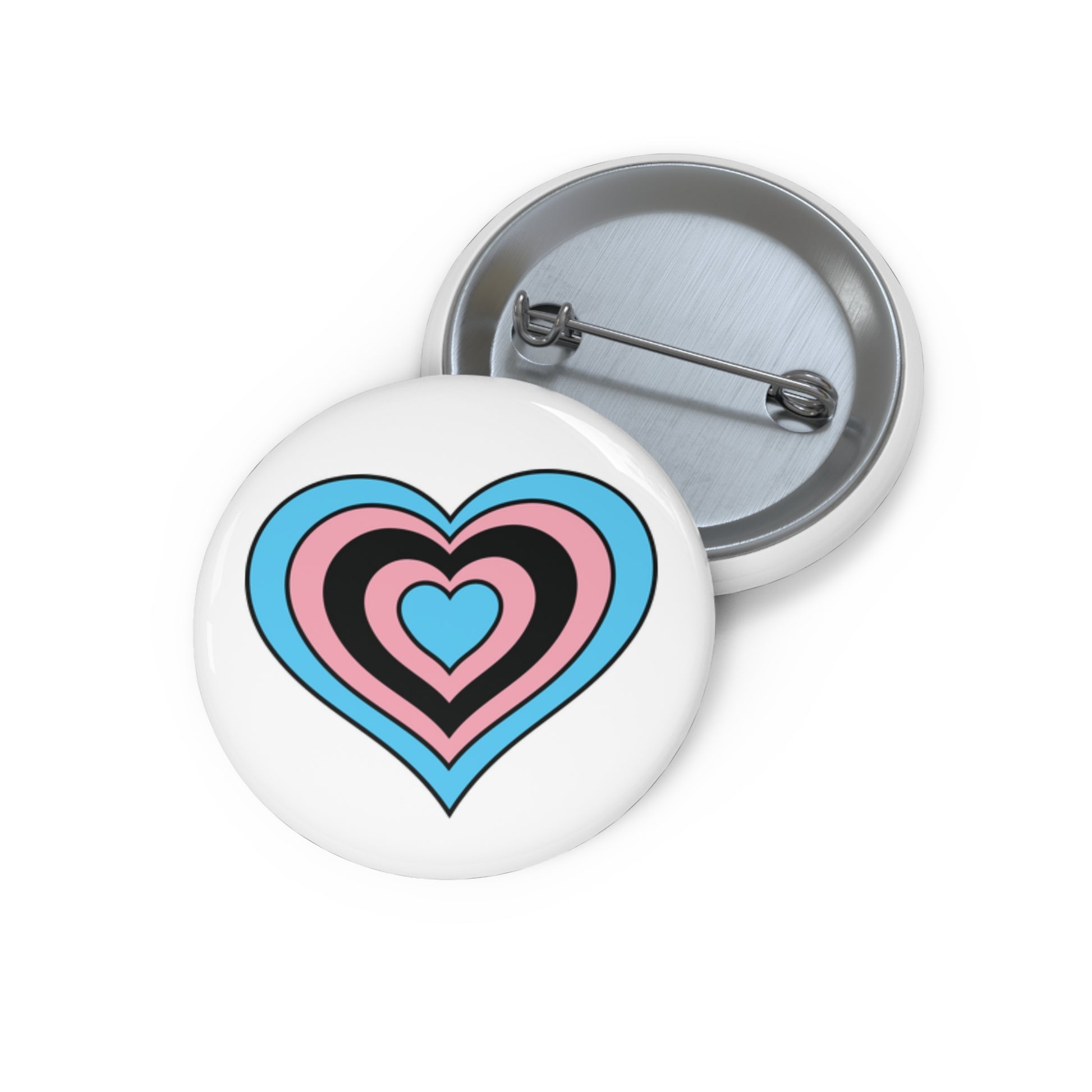 Front and back view of a white circular button with a heart-shaped black transgender flag image. The button is shown on a white background.