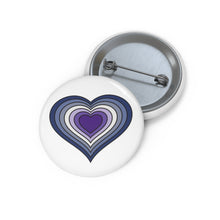 Front and back view of a circular pride button featuring a nested heart design inspired by the purple butch pride flag in blue, light blue, lighter blue, white, lavender, purple and dark purple. The design has a thin black border, and the button is shown on a white background.
