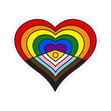 Heart-shaped intersex-inclusive progress pride flag sticker featuring nested heart stripes in black, brown, light blue, pink, white, yellow with a purple circle, red, orange, yellow, green, blue and purple, outlined with a thin black border and a white sticker border. The sticker is shown on a white background.
