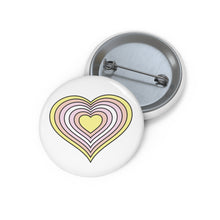 Front and back view of a white circular button with a pangender pride flag inspired heart-shaped image. The image has 6 nested hearts each colored from a corresponding stripe on the pangender pride flag. The button is shown on a white background.