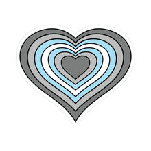 Heart-shaped demiboy pride flag sticker featuring nested heart stripes in dark gray, light gray, white, light blue, and light blue, outlined with a thin black border and a white sticker border. The sticker is shown on a white background.