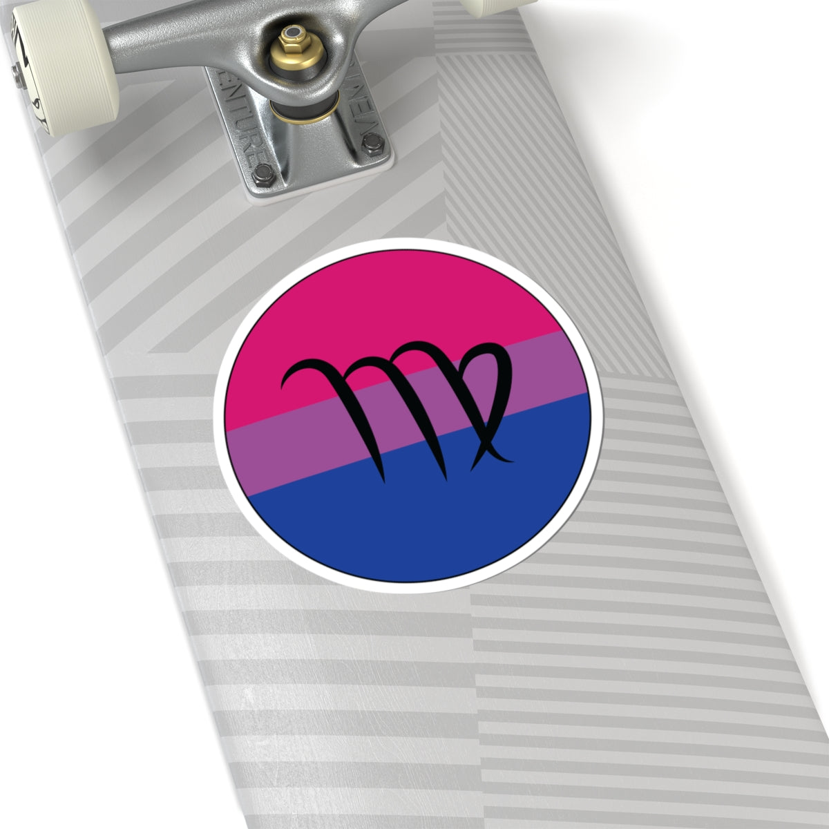 Close-up of the bottom of a silver skateboard featuring a 6 inch by 6 inch circular zodiac sticker with a centered Virgo glyph on a Bisexual pride flag style background applied to the surface.