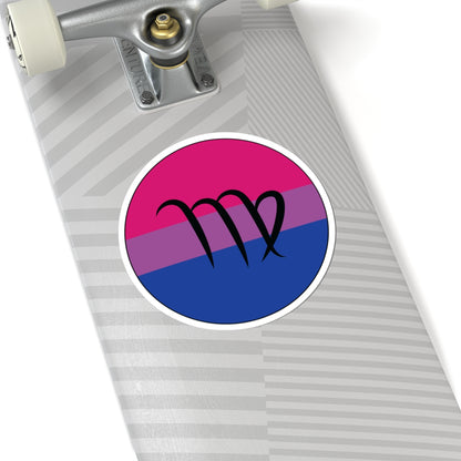 Close-up of the bottom of a silver skateboard featuring a 6 inch by 6 inch circular zodiac sticker with a centered Virgo glyph on a Bisexual pride flag style background applied to the surface.