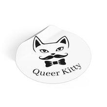 Sticker with a cat face with a mustache and bow tie and 'Queer Kitty' text on a white background