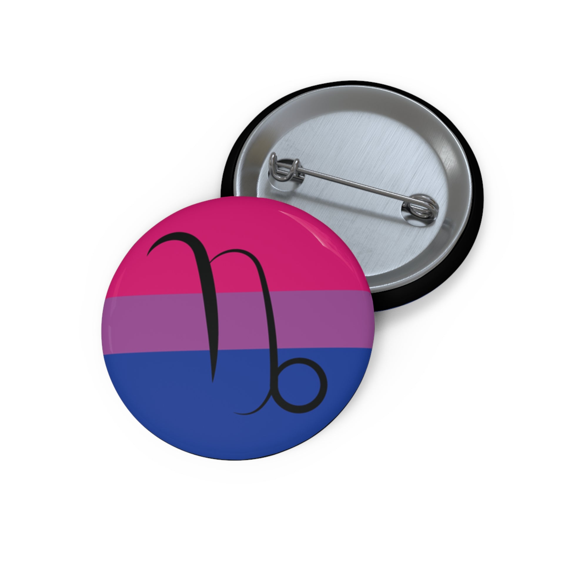 Front and back view of a circular bisexual pride flag button featuring the Capricorn zodiac symbol in black centered on the front.