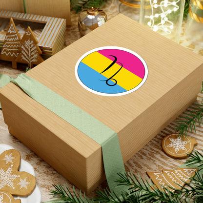 Gift box with a green ribbon on a festive background with cookies and Christmas decorations. Capricorn Pansexual pride sticker centered on the box.
