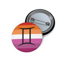 Front and back view of a circular lesbian pride flag button featuring the Gemini zodiac symbol in black centered on the front.