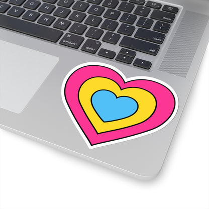 Close-up of the bottom right corner of a silver laptop featuring a 4 inch by 4 inch pride flag heart sticker in a Pansexual flag style applied to the surface.