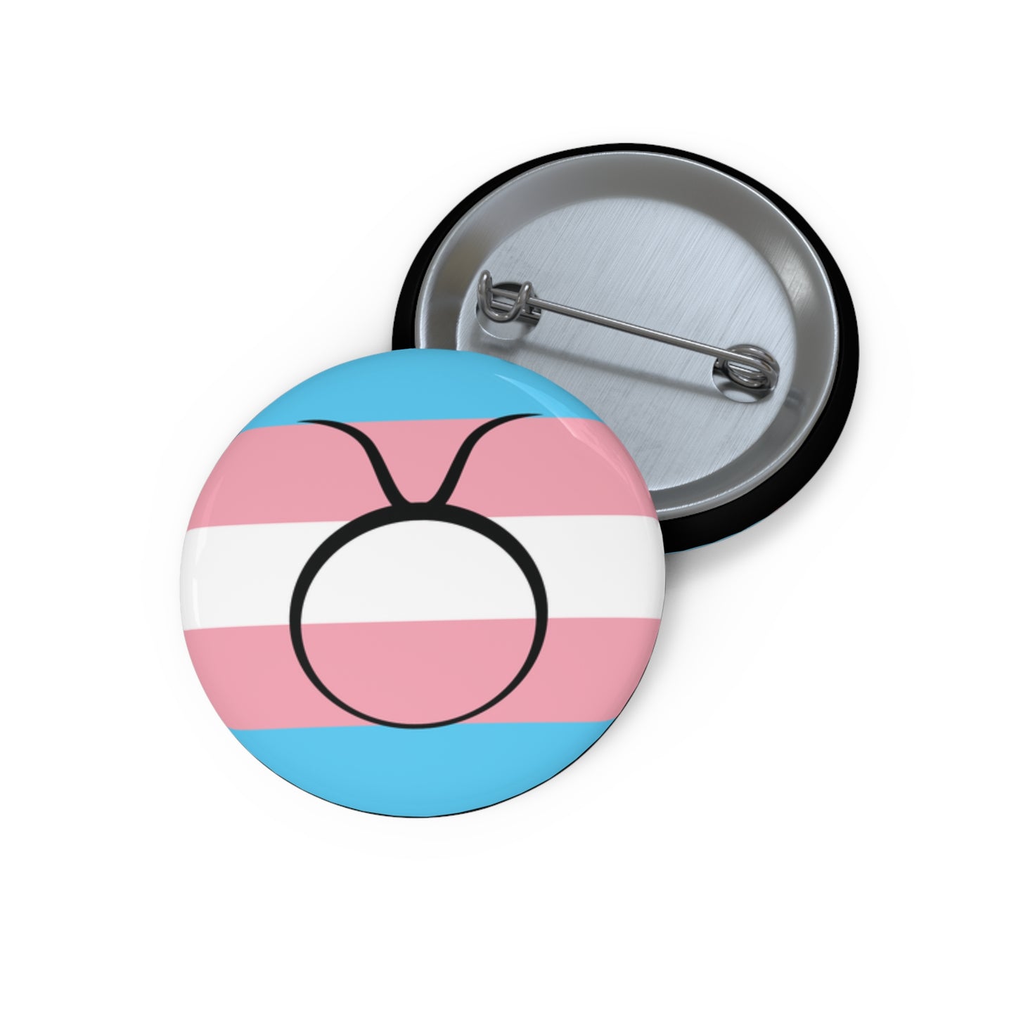 Front and back view of a circular transgender pride flag button featuring the Taurus zodiac symbol in black centered on the front.