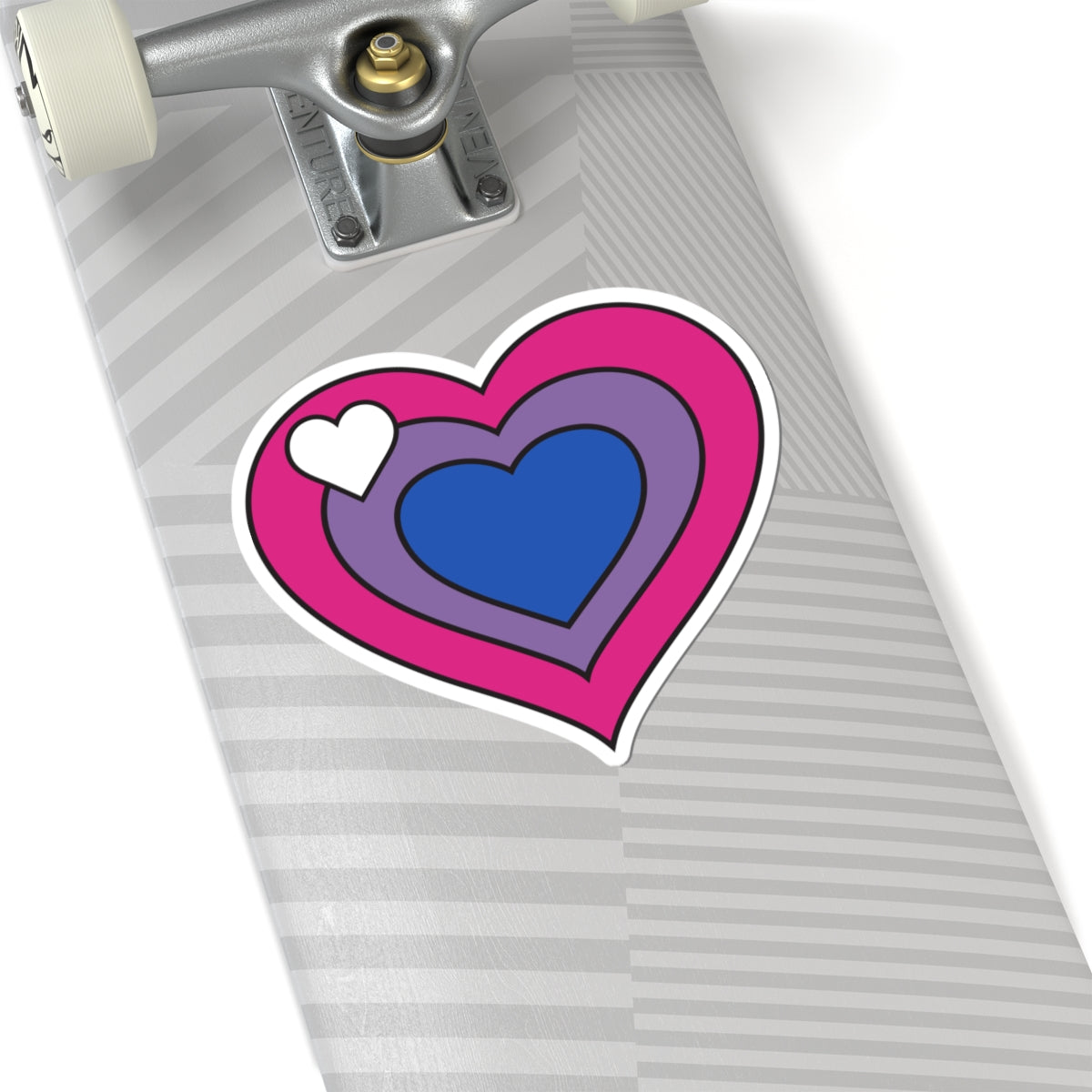 Close-up of the bottom of a silver skateboard featuring a 6 inch by 6 inch pride flag heart sticker in a Biromantic flag style applied to the surface.