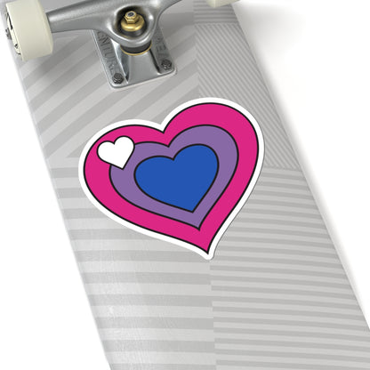 Close-up of the bottom of a silver skateboard featuring a 6 inch by 6 inch pride flag heart sticker in a Biromantic flag style applied to the surface.