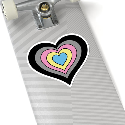 Close-up of the bottom of a silver skateboard featuring a 6 inch by 6 inch pride flag heart sticker in a Polygender flag style applied to the surface.