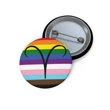 Front and back view of a circular progress pride flag button featuring the Aries zodiac symbol in black centered on the front.