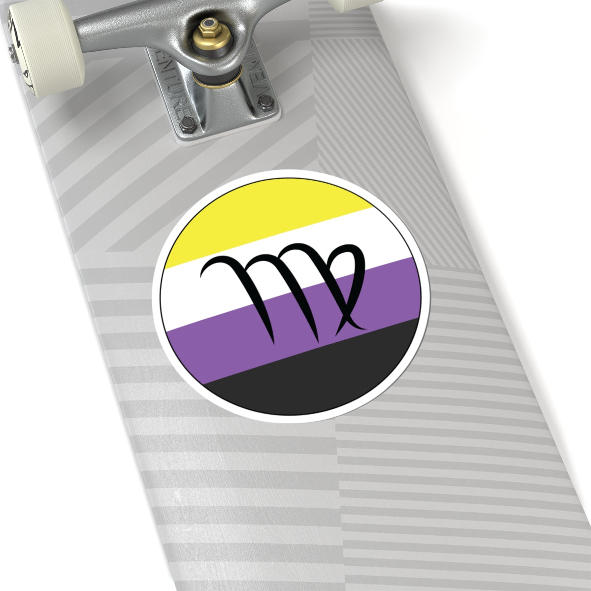 Close-up of the bottom right corner of a silver laptop featuring a 6 inch by 6 inch circular zodiac sticker with a centered Virgo glyph on a Nonbinary pride flag style background applied to the surface.