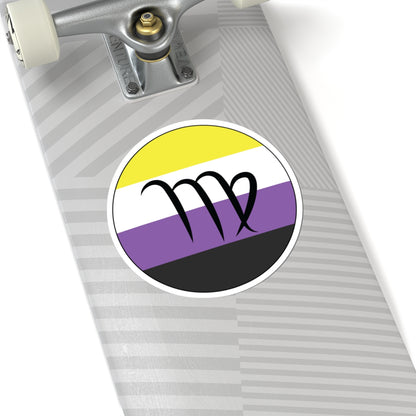 Close-up of the bottom right corner of a silver laptop featuring a 6 inch by 6 inch circular zodiac sticker with a centered Virgo glyph on a Nonbinary pride flag style background applied to the surface.