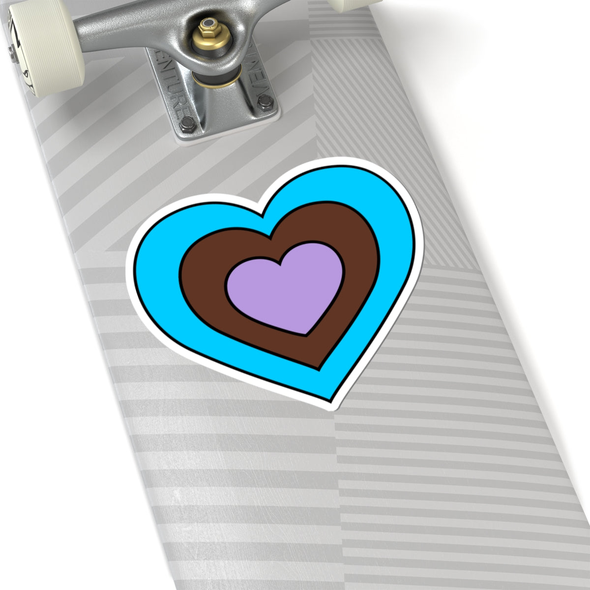 Close-up of the bottom right corner of a silver laptop featuring a 6 inch by 6 inch pride flag heart sticker in an Androsexual flag style applied to the surface.