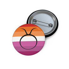 Front and back view of a circular lesbian pride flag button featuring the Taurus zodiac symbol in black centered on the front.