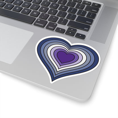 Close-up of the bottom of a silver skateboard featuring a 4 inch by 4 inch pride flag heart sticker in a purple butch pride flag style applied to the surface.