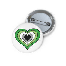 Front and back view of a white circular button with a heart-shaped aromantic flag image. The button is shown on a white background.