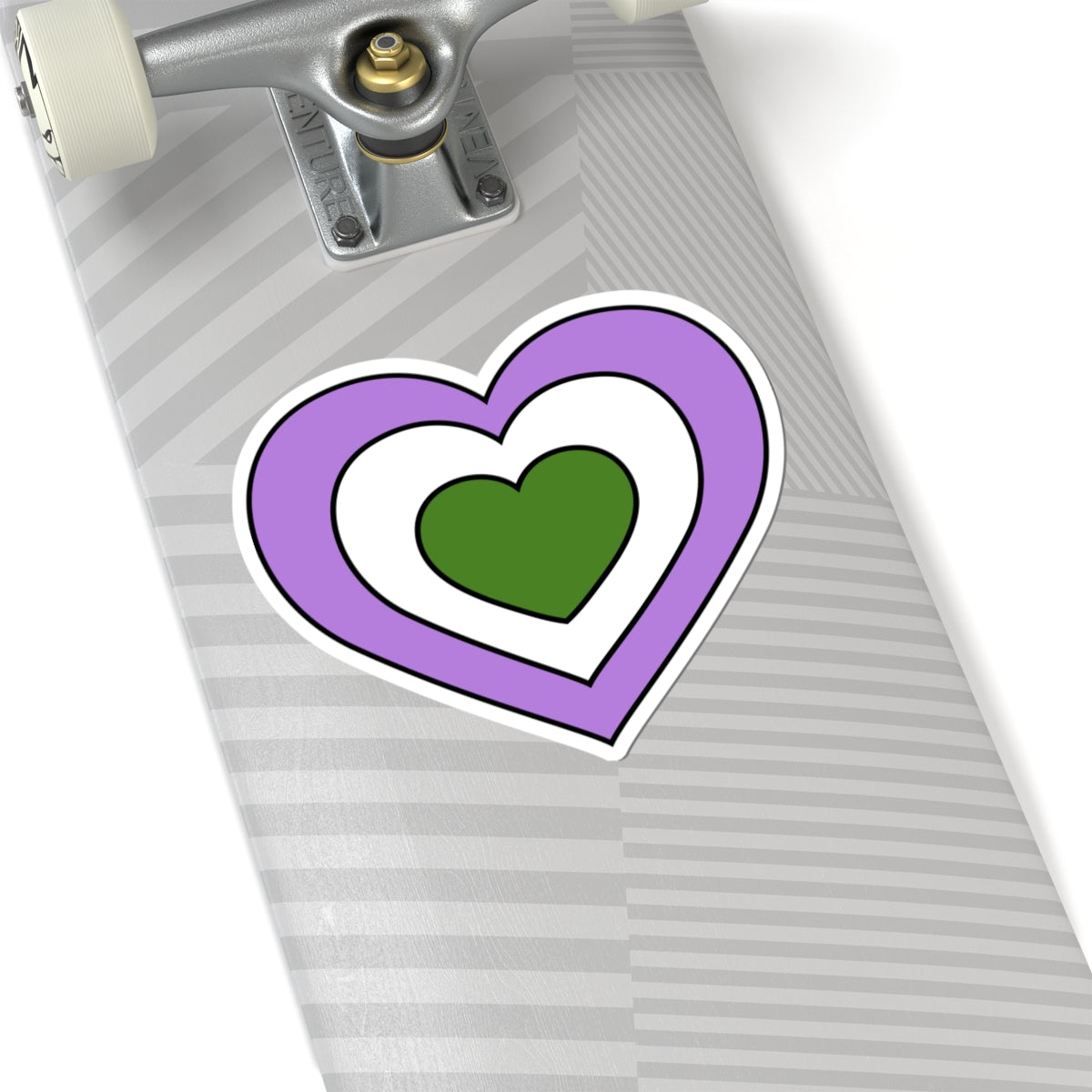 Close-up of the bottom of a silver skateboard featuring a 6 inch by 6 inch pride flag heart sticker in a Genderqueer flag style applied to the surface.
