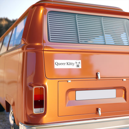Orange van with a white Queer Kitty bumper sticker on the back