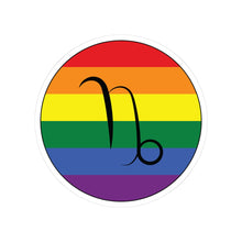 Circular rainbow pride flag zodiac sticker with a thin black outline and white sticker border, featuring a centered black Capricorn zodiac glyph. The sticker is shown on a white background.
