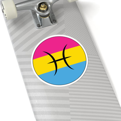 Close-up of the bottom of a silver skateboard featuring a 6 inch by 6 inch circular zodiac sticker with a centered Pisces glyph on a Pansexual pride flag style background applied to the surface.