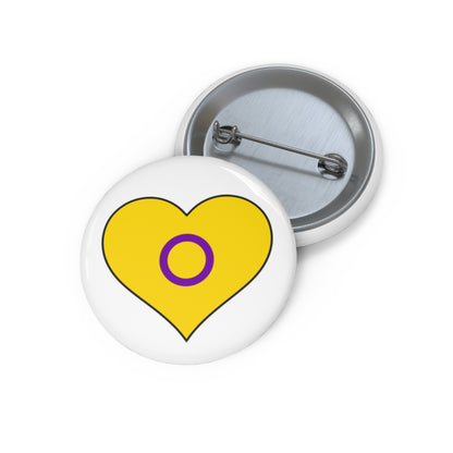 Front and back view of a white circular button with a heart-shaped Intersex flag image. The button is shown on a white background.