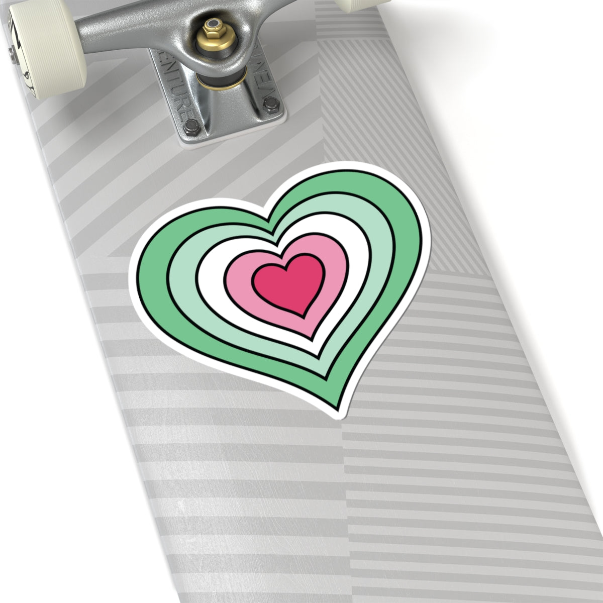Close-up of the bottom of a silver laptop featuring a 6 inch by 6 inch pride flag heart sticker in an Abrosexual flag style applied to the surface.