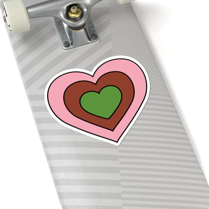 Close-up of the bottom of a silver skateboard featuring a 6 inch by 6 inch pride flag heart sticker in a Gynesexual flag style applied to the surface.