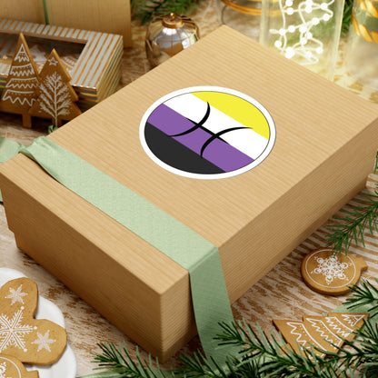 Gift box with a green ribbon on a festive background with cookies and Christmas decorations. Pisces Nonbinary pride sticker centered on the box.