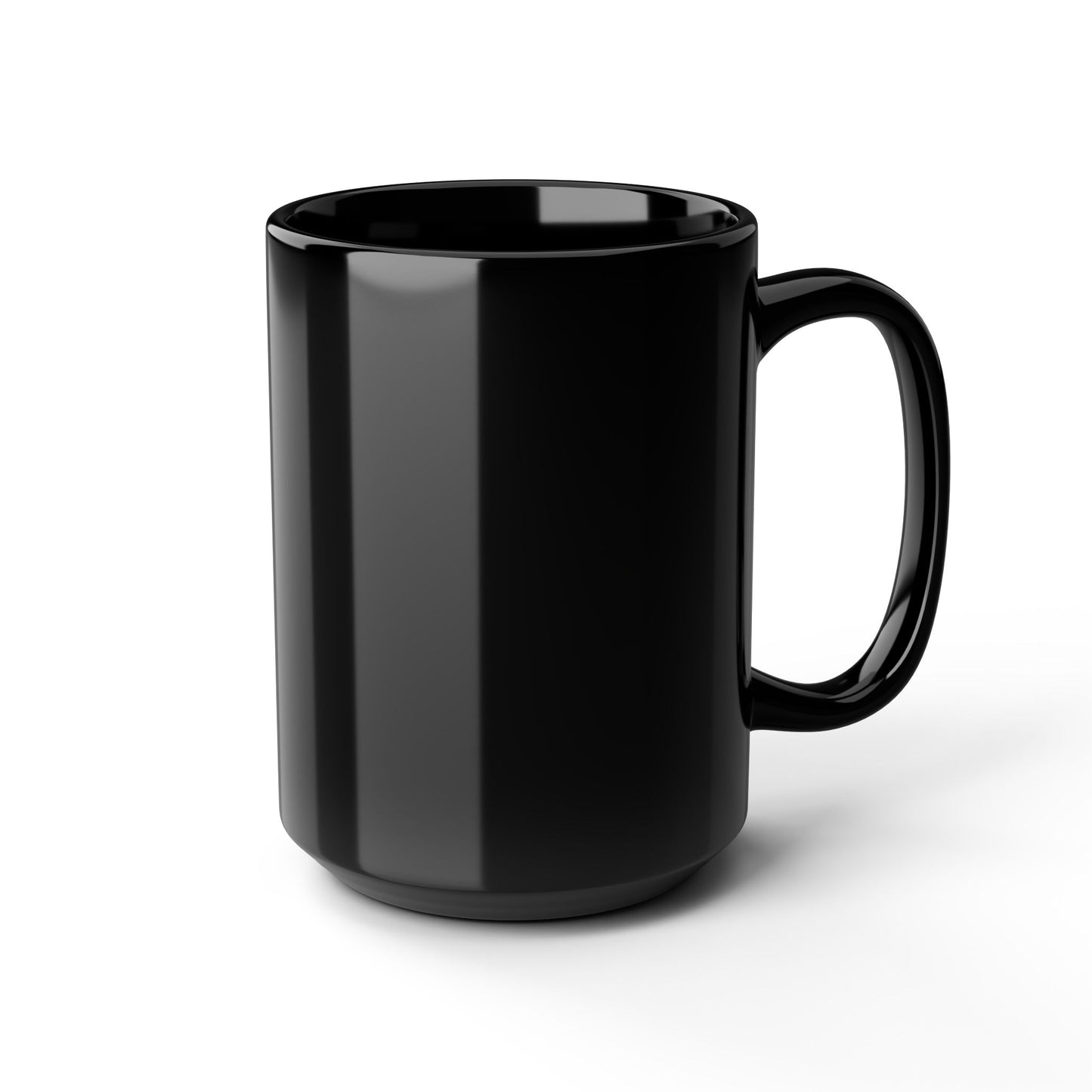 A black mug is shown on a white background. This side of the mug is blank. The handle is on the right. There is light reflecting onto the mug.